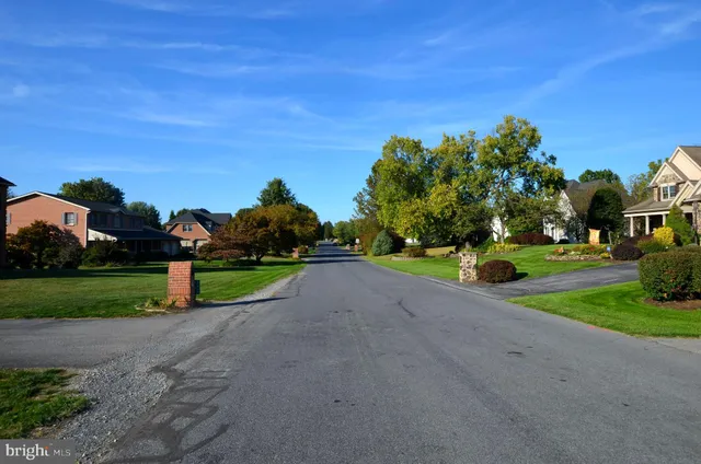 a view of a park with houses