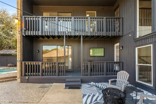 a view of a patio with a table and chairs