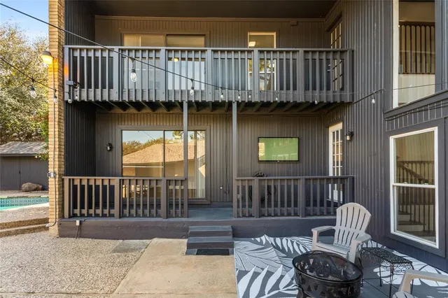 a view of a patio with a table and chairs