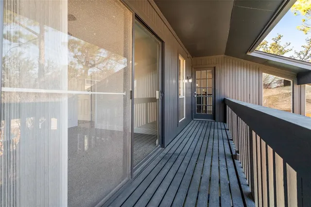 a view of gallery with wooden floor