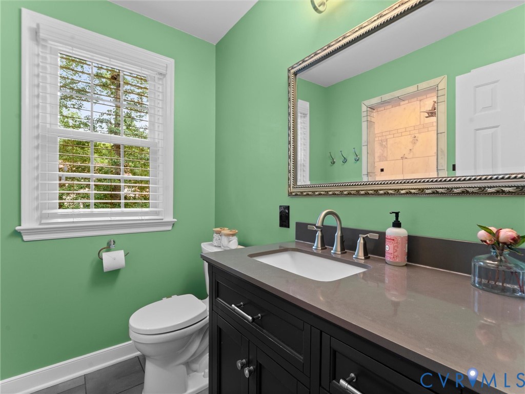 721 Milbrae Road North Chesterfield, VA 23236 - Photo 29 of 63 Updated bath with large vanity, tile flooring, and