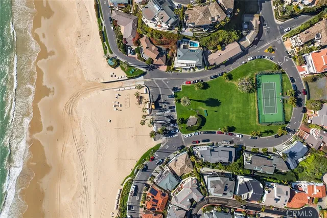 a picture of a building with a couple of cars parked in front of it