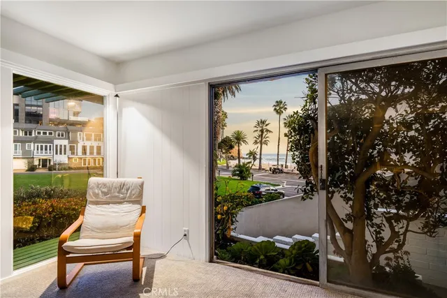 a view of a chair and table in the porch