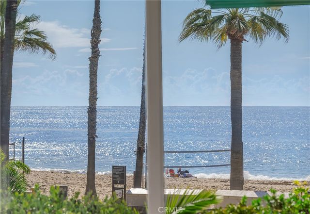 a living room with furniture and large windows