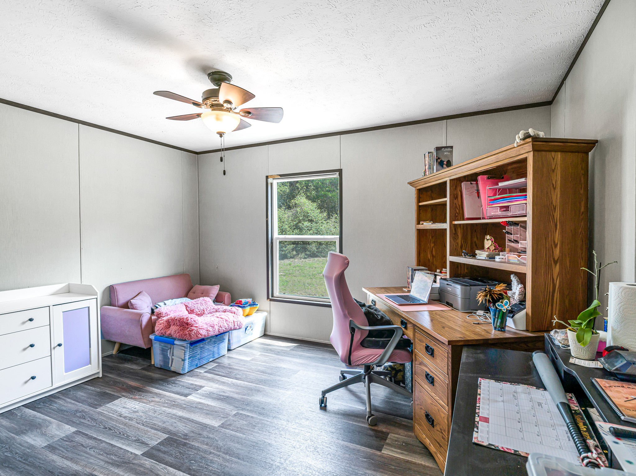 1047 Jimbob Lane New Ulm, TX 78950 - Photo 11 of 18 Secondary bedroom currently being used as an office. Complete with ceiling fan and a window view out to your 3.13 acres!