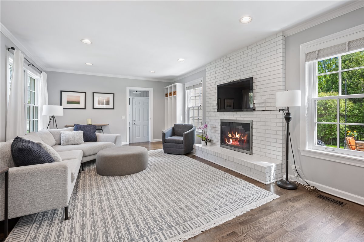 910 Chippewa Lane Wilmette, IL 60091 - Photo 11 of 38 a living room with furniture a flat screen tv and a fireplace