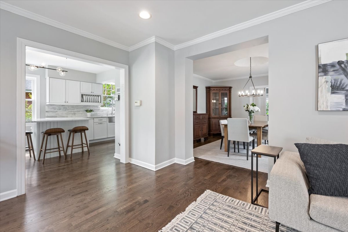 910 Chippewa Lane Wilmette, IL 60091 - Photo 12 of 38 a view of a livingroom with furniture and a dining table wooden floor