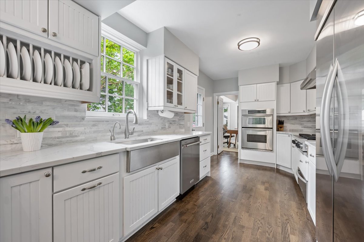 910 Chippewa Lane Wilmette, IL 60091 - Photo 13 of 38 a kitchen with stainless steel appliances sink refrigerator and cabinets