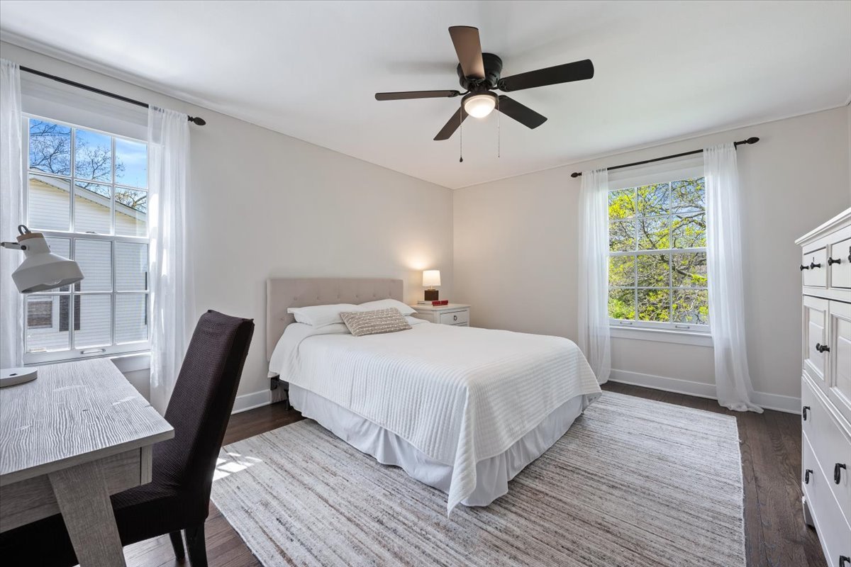 910 Chippewa Lane Wilmette, IL 60091 - Photo 23 of 38 a bedroom with a bed a chandelier and a window