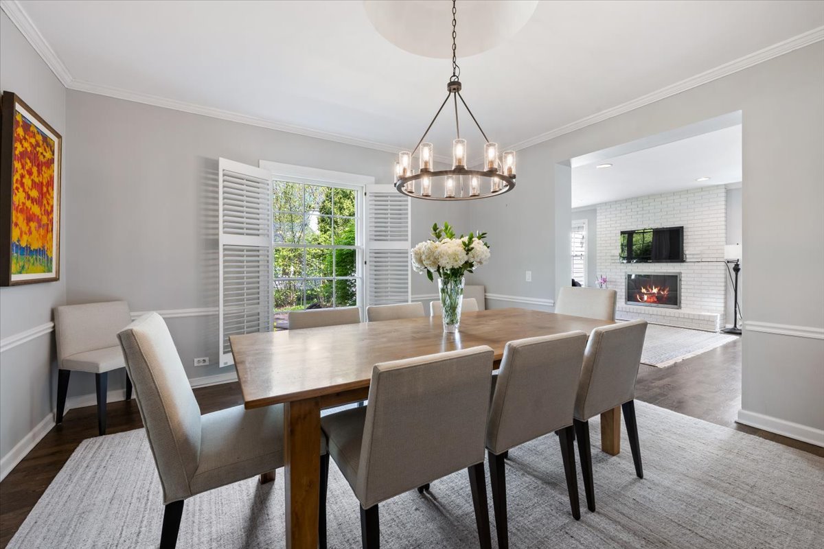 910 Chippewa Lane Wilmette, IL 60091 - Photo 9 of 38 a view of a dining room with furniture a chandelier and wooden floor