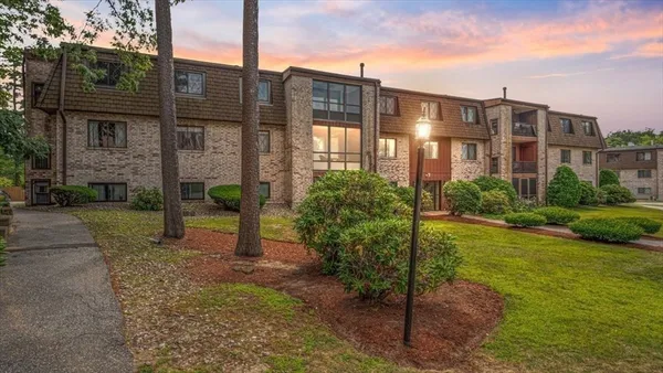 a view of a building with a yard
