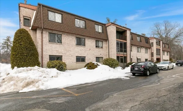 a view of a car park in front of a building