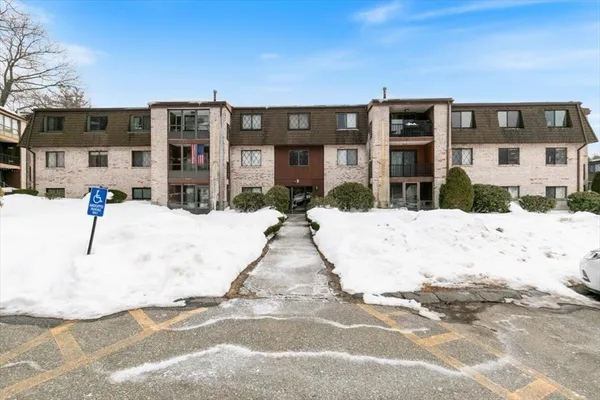 a view of a building with a snow in the background