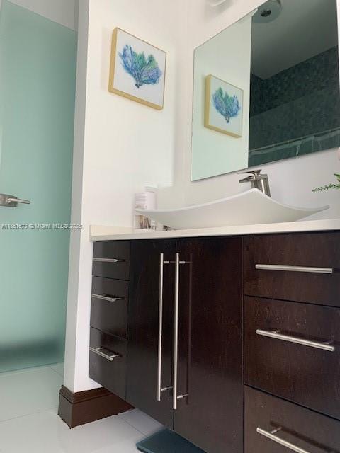 19260 Southwest 134th Ave Road Miami, FL 33177 - Photo 14 of 14 a bathroom with a sink and a mirror
