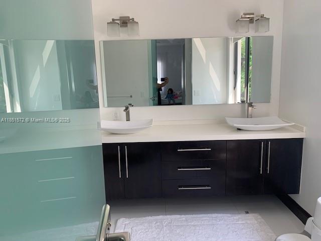 19260 Southwest 134th Ave Road Miami, FL 33177 - Photo 7 of 14 a bathroom with a sink and a mirror