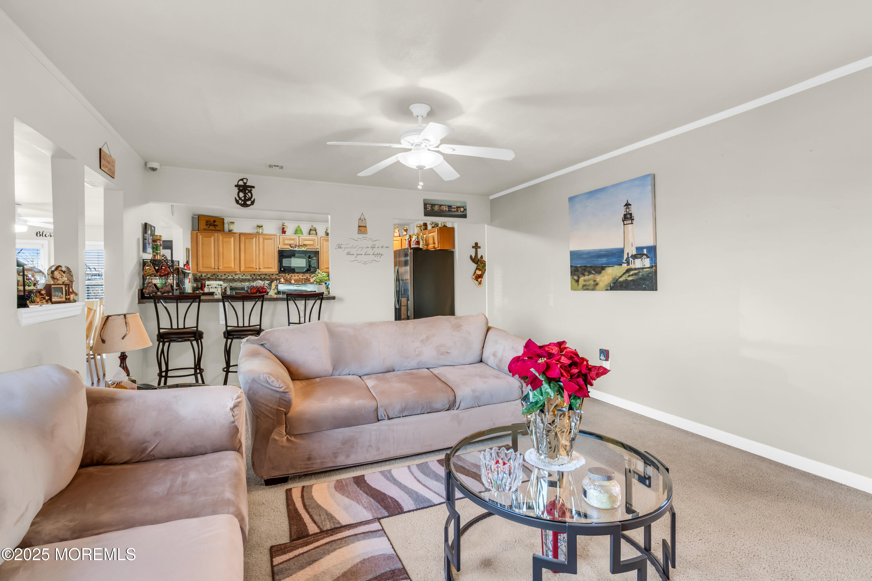 230 Montclair Road South Barnegat, NJ 08005 - Photo 11 of 28 a living room with furniture dining table and a chandelier