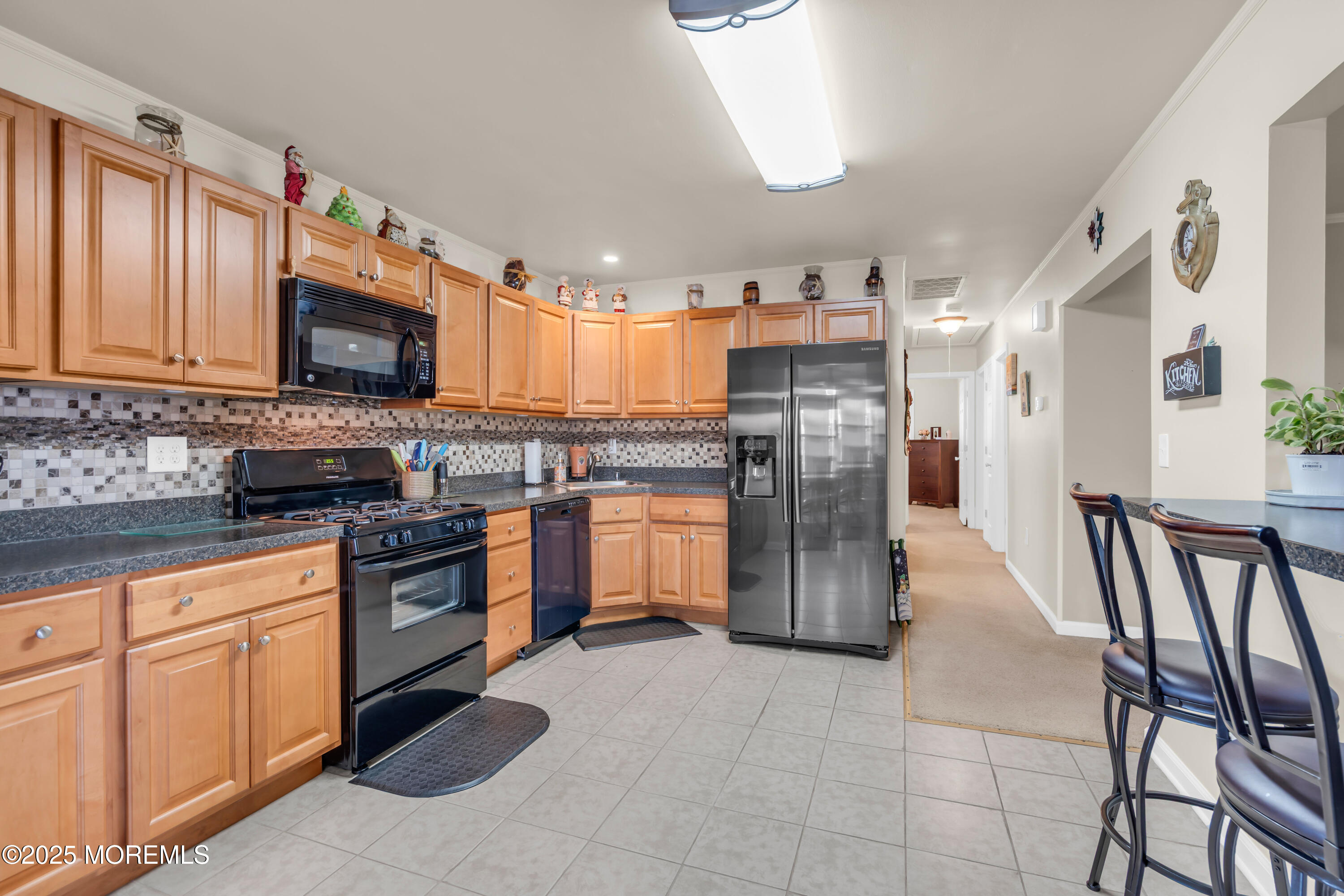 230 Montclair Road South Barnegat, NJ 08005 - Photo 15 of 28 a kitchen with stainless steel appliances granite countertop a refrigerator a stove top oven a sink and dishwasher
