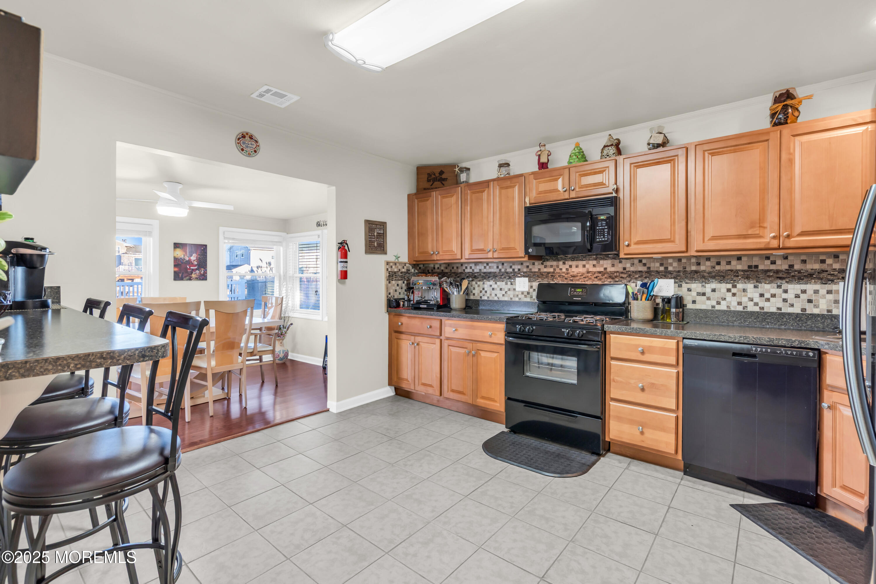 230 Montclair Road South Barnegat, NJ 08005 - Photo 16 of 28 a kitchen with stainless steel appliances granite countertop a stove top oven a sink dishwasher and a refrigerator