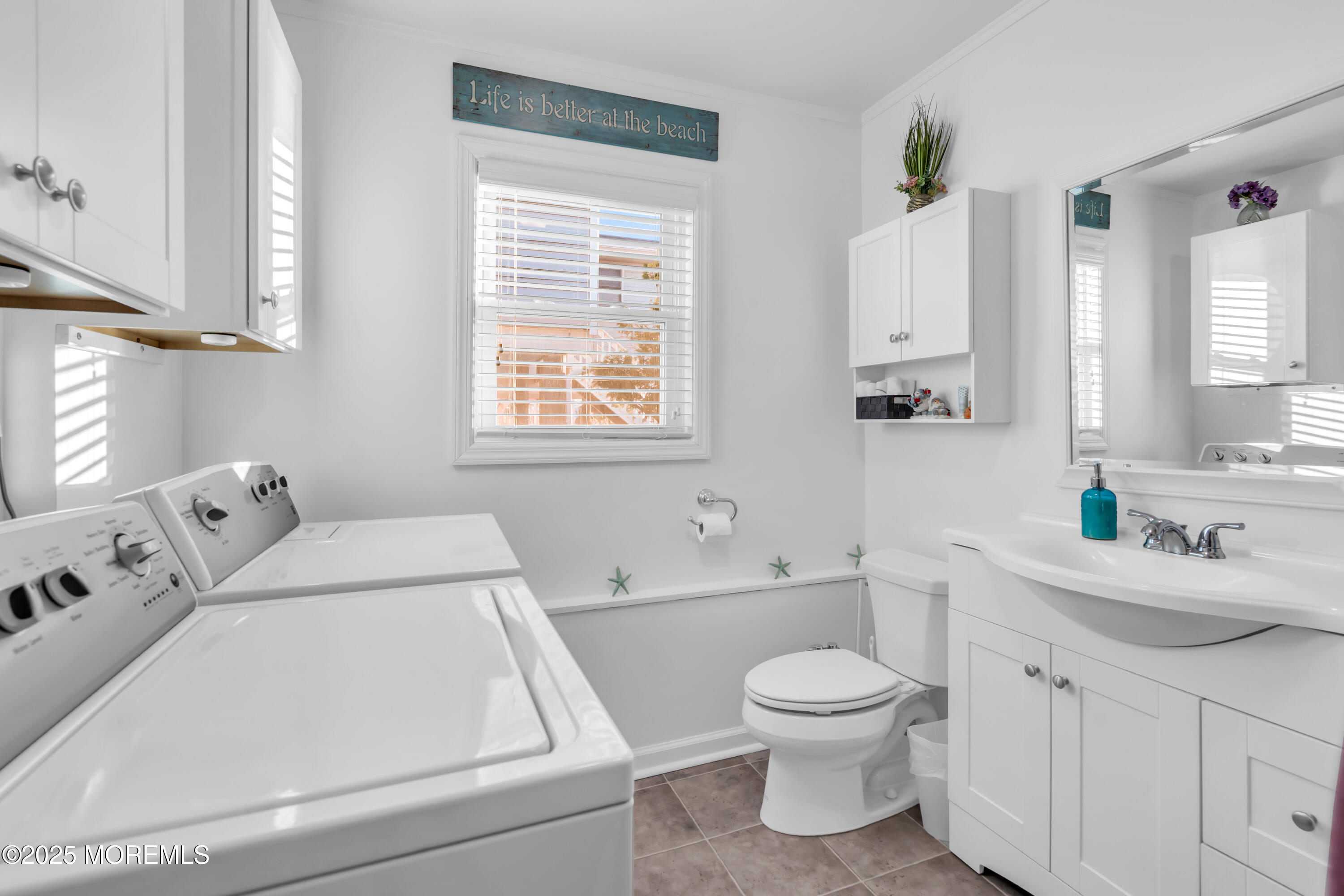 230 Montclair Road South Barnegat, NJ 08005 - Photo 23 of 28 a bathroom with a toilet sink a mirror and a window