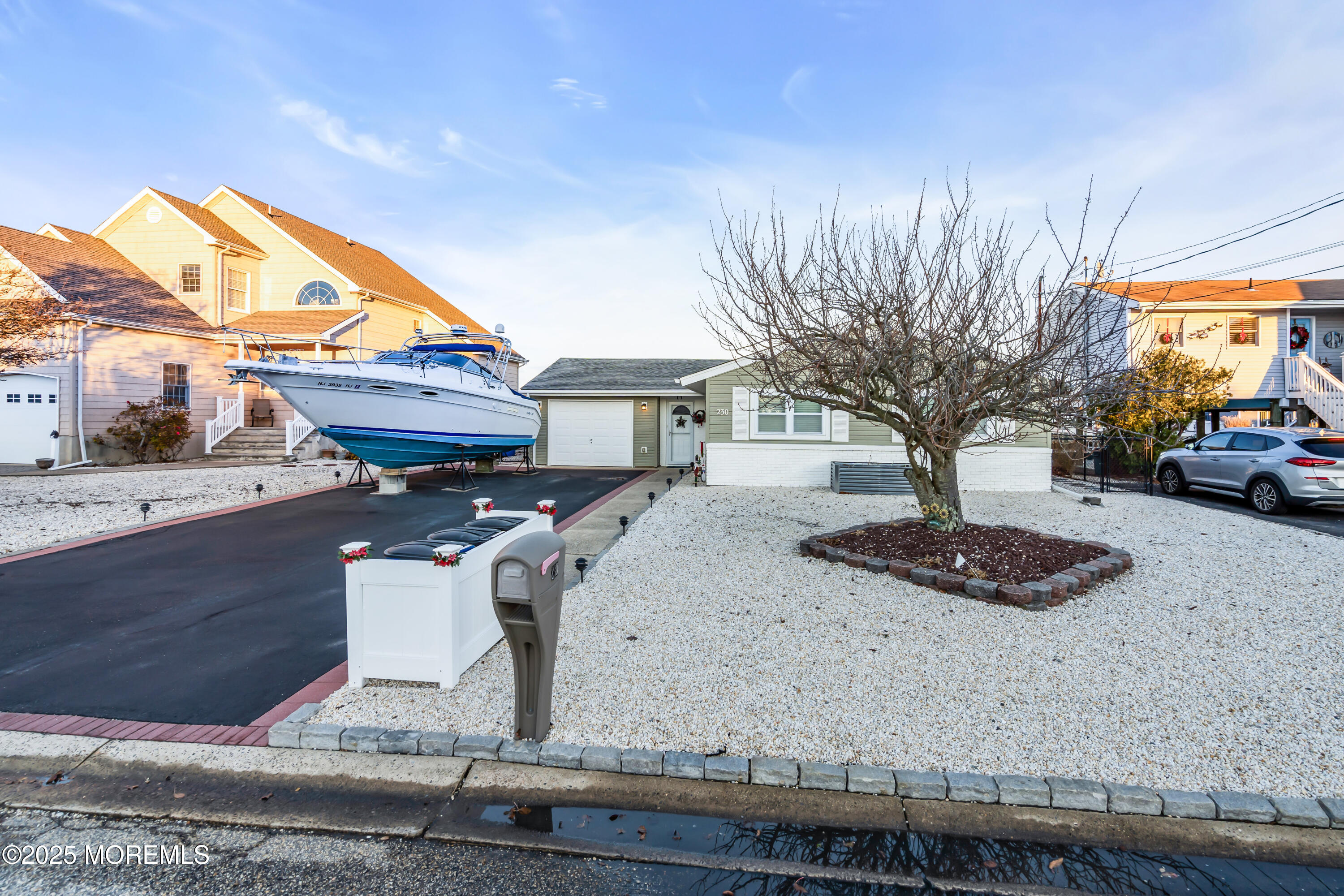 230 Montclair Road South Barnegat, NJ 08005 - Photo 24 of 28 a front view of a house with garden