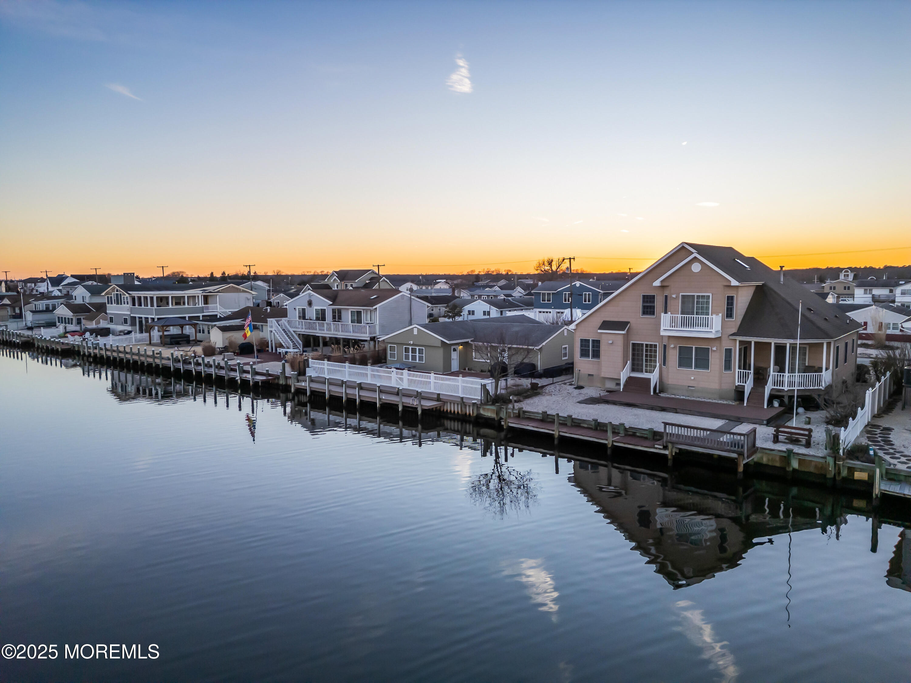 230 Montclair Road South Barnegat, NJ 08005 - Photo 26 of 28 a view of a lake with a houses in the background