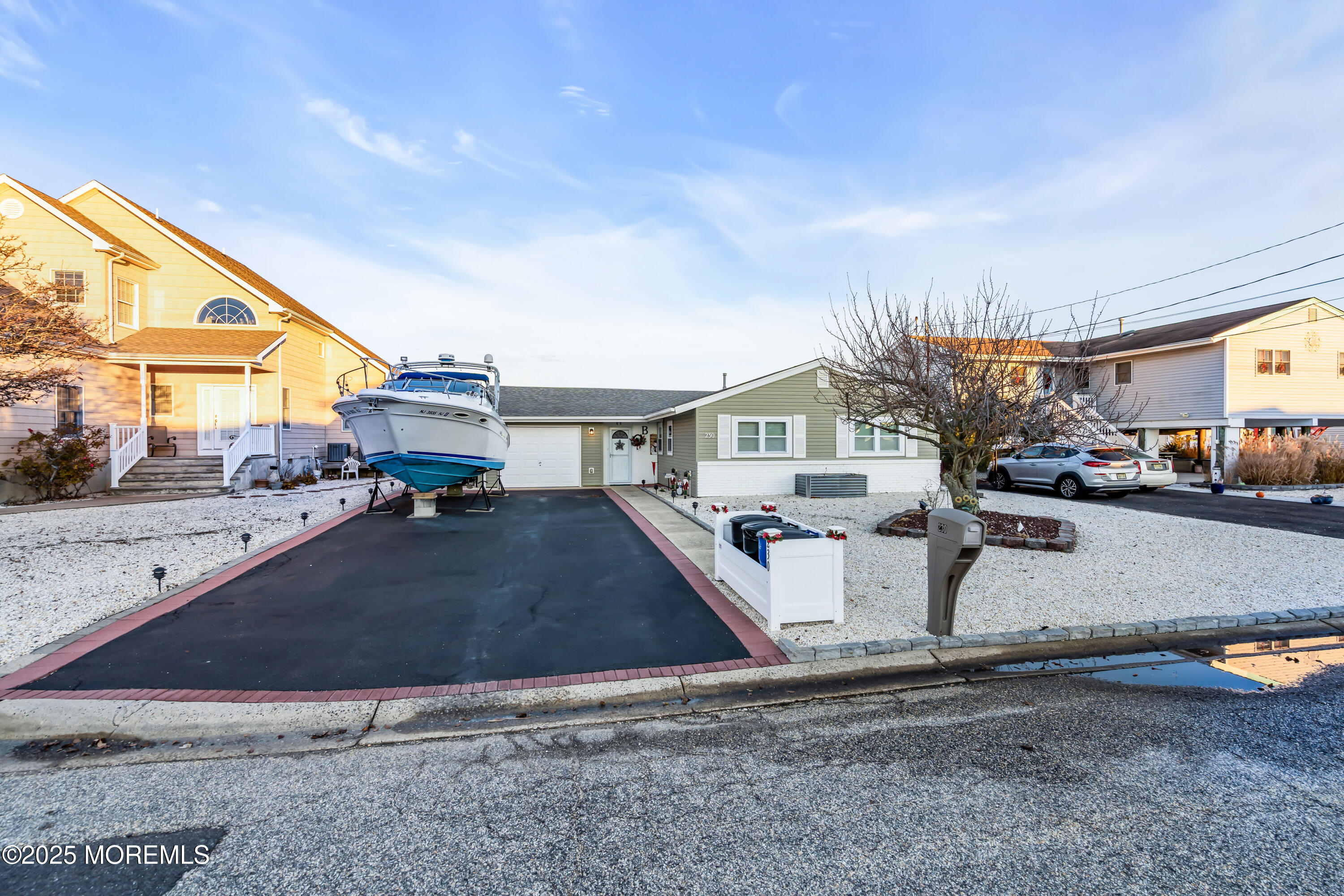 230 Montclair Road South Barnegat, NJ 08005 - Photo 3 of 28 a view of a white house next to a yard