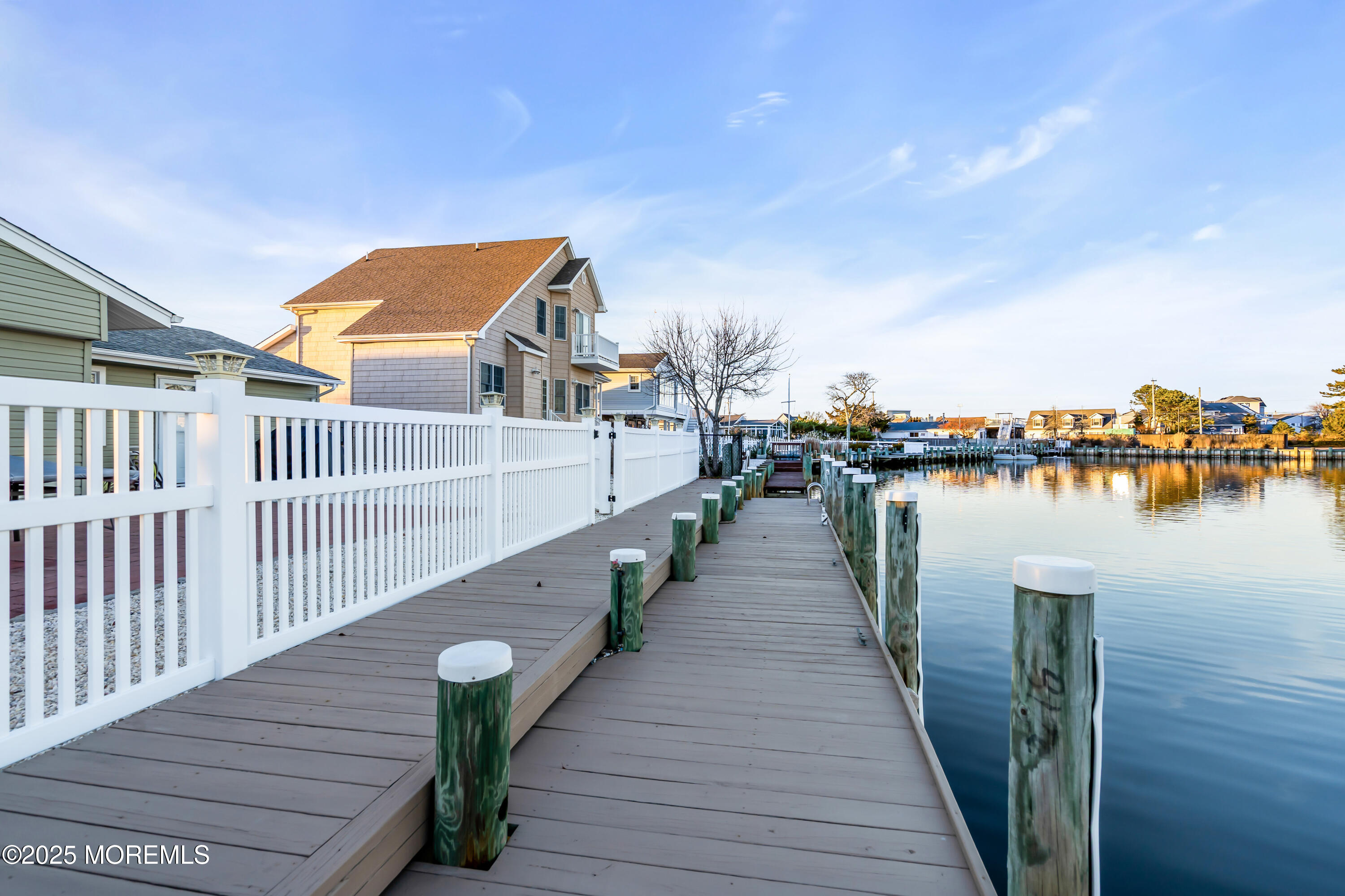 230 Montclair Road South Barnegat, NJ 08005 - Photo 6 of 28 a balcony with wooden floor and lake view