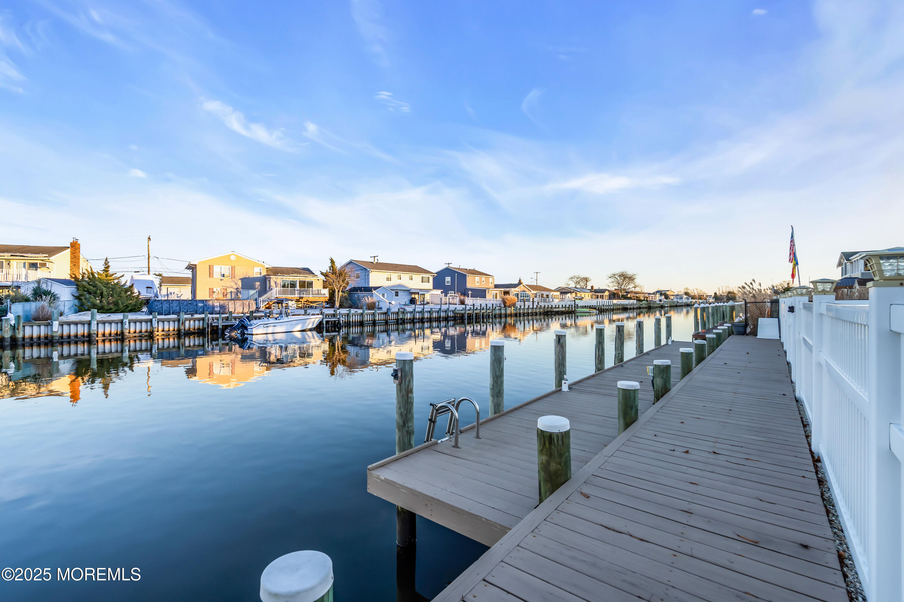 230 Montclair Road South Barnegat, NJ 08005 - Photo 7 of 28 a view of a lake with boats and palm trees