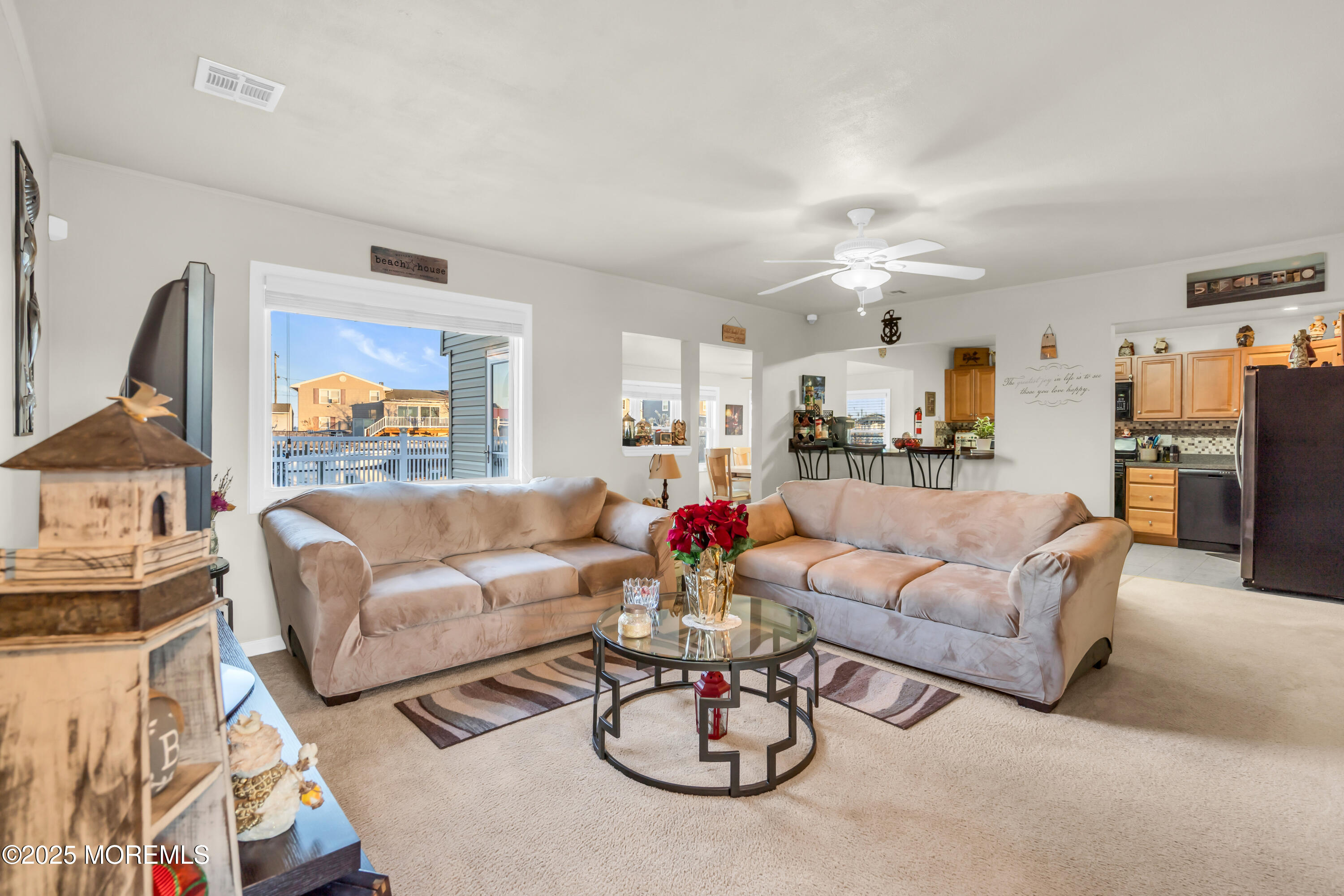 230 Montclair Road South Barnegat, NJ 08005 - Photo 10 of 28 a living room with furniture kitchen view and a chandelier