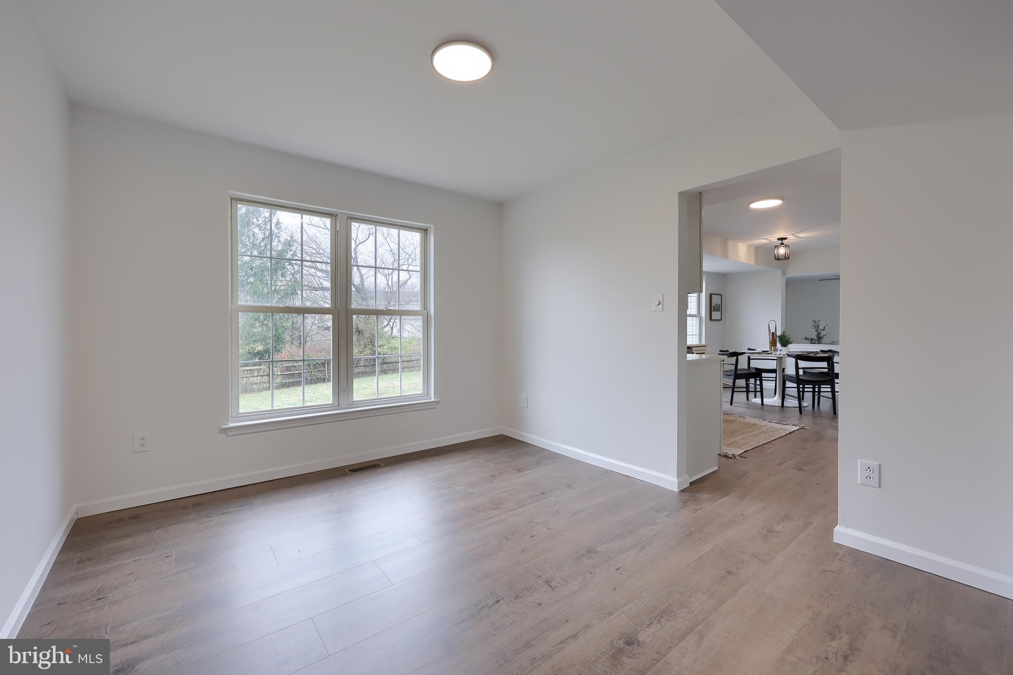 40 Gunpowder Lane Reading, PA 19606 - Photo 12 of 59 an empty room with wooden floor and a window