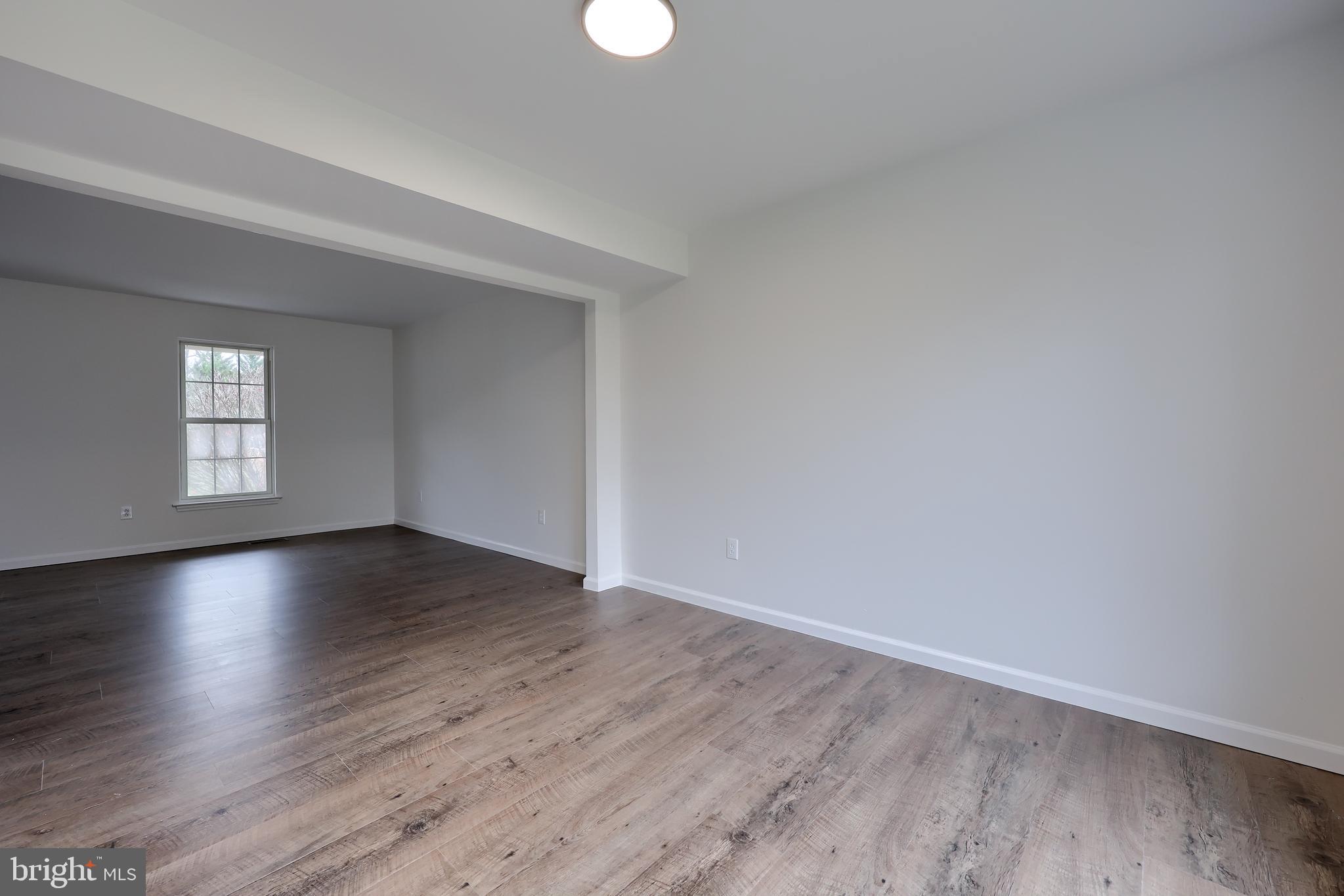 40 Gunpowder Lane Reading, PA 19606 - Photo 13 of 59 an empty room with wooden floor and windows
