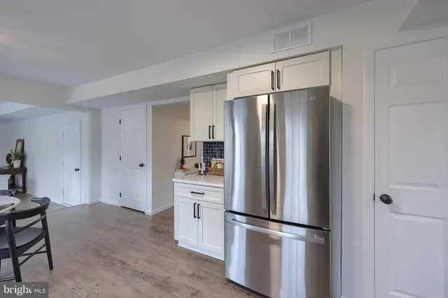 a view of a dining room with furniture and window