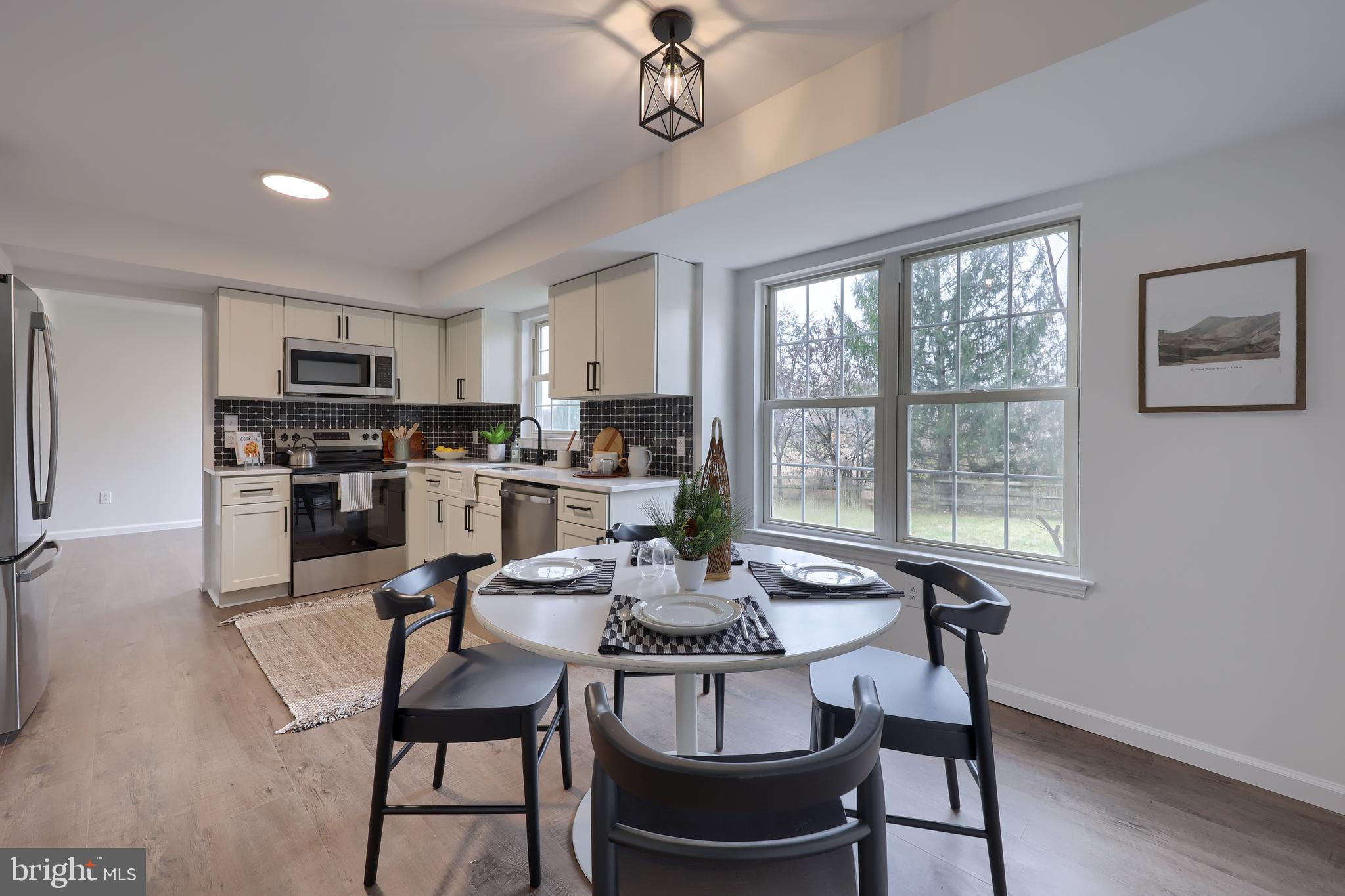 40 Gunpowder Lane Reading, PA 19606 - Photo 22 of 59 a view of a dining room with furniture window and wooden floor