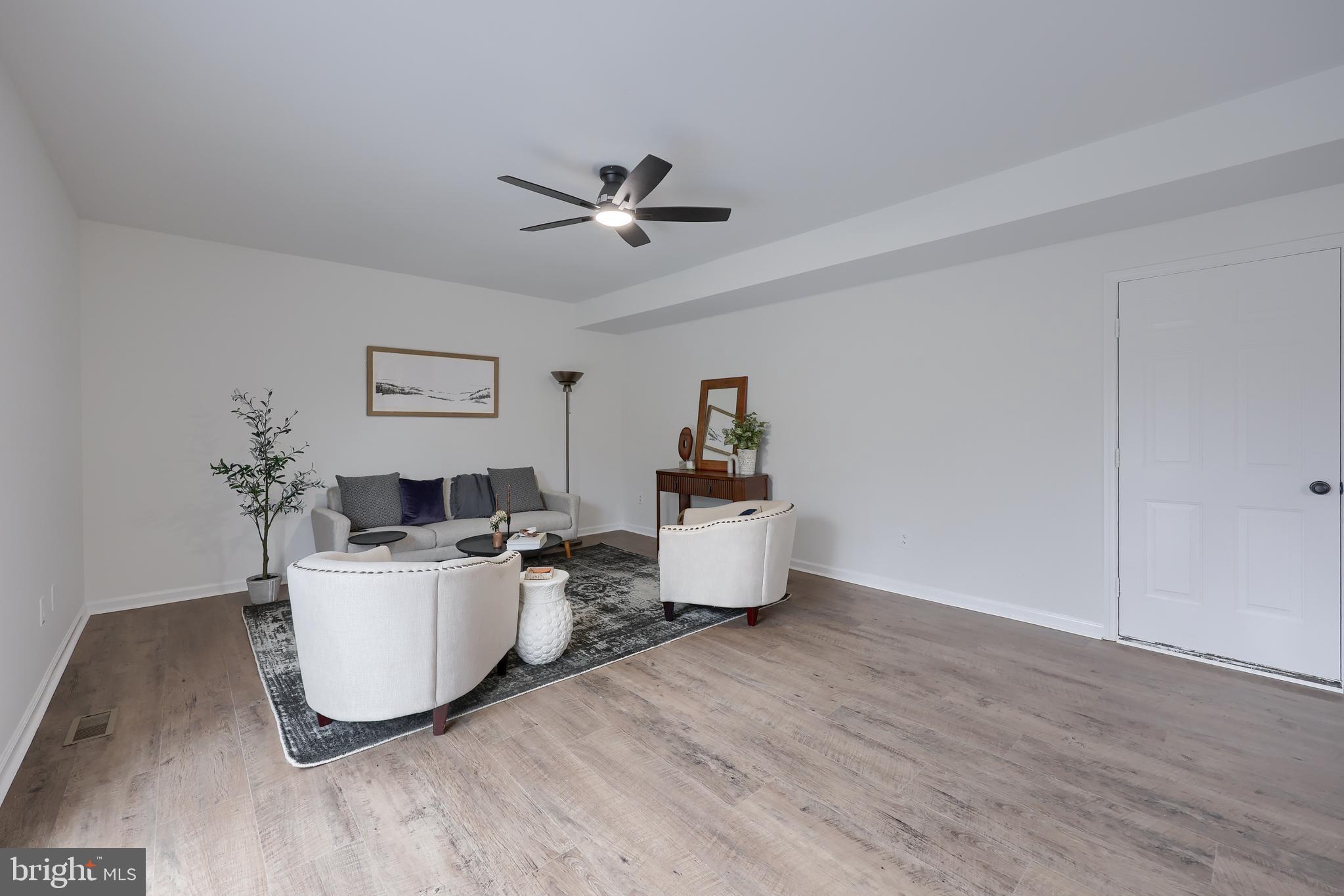 40 Gunpowder Lane Reading, PA 19606 - Photo 25 of 59 a living room with furniture and a wooden floor