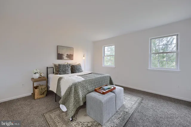 a white toilet sitting next to a shower