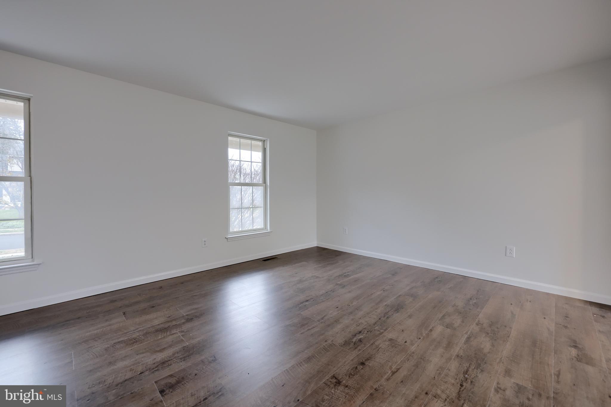 40 Gunpowder Lane Reading, PA 19606 - Photo 40 of 59 an empty room with wooden floor and windows