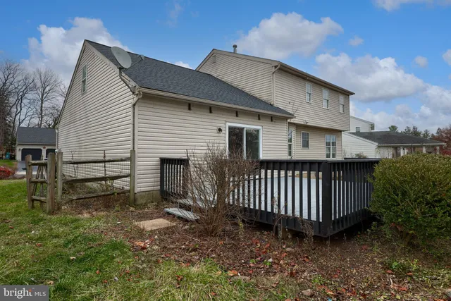 an aerial view of residential house with outdoor space and parking