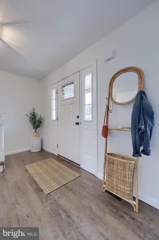 a view of entryway with wooden floor