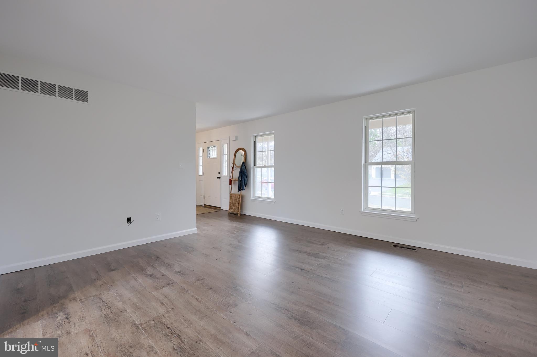 40 Gunpowder Lane Reading, PA 19606 - Photo 10 of 59 an empty room with wooden floor and windows