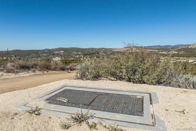 a view of a yard with an ocean