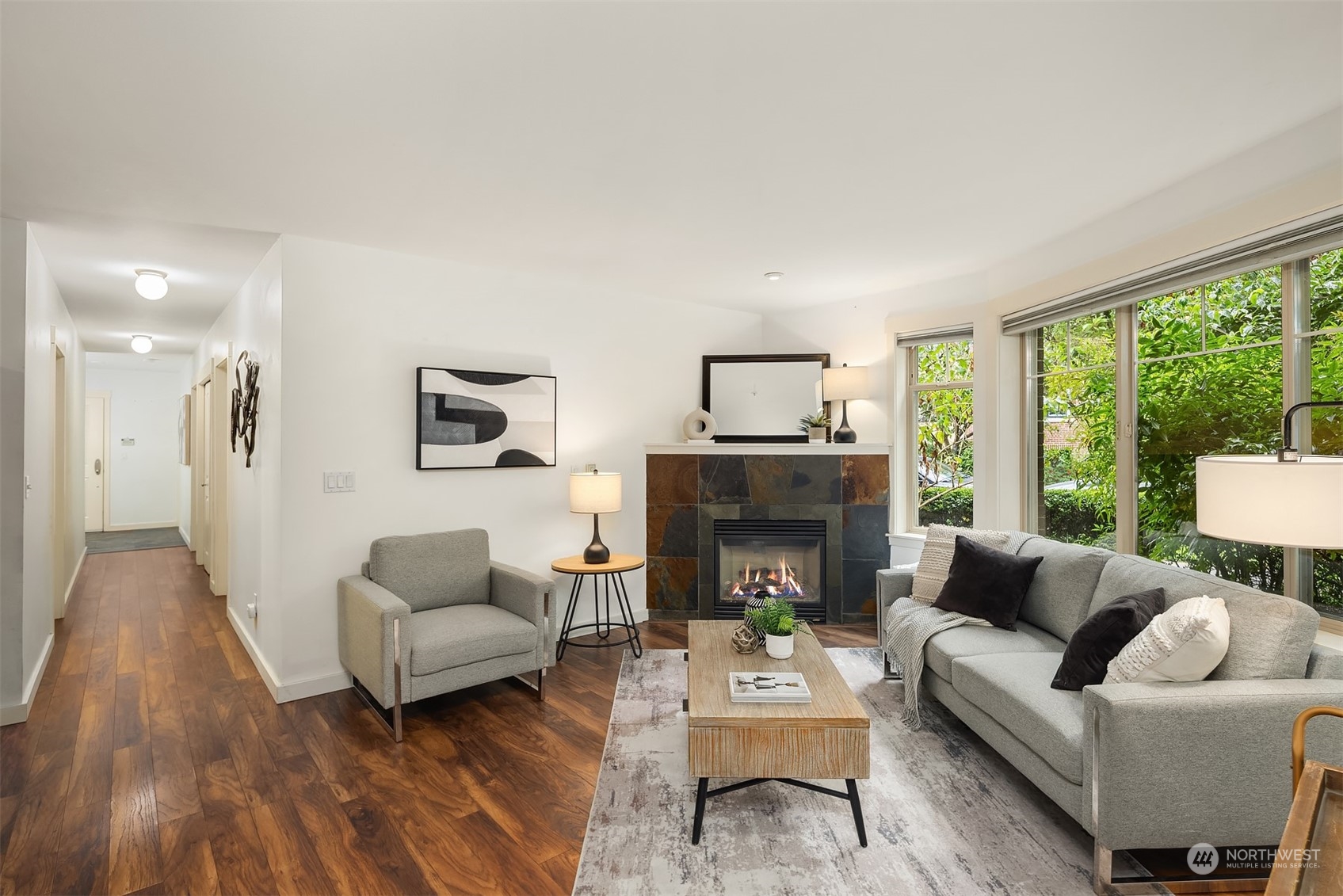 1621 East Spring Street, Unit 1B Seattle, WA 98122 - Photo 4 of 25 a living room with furniture and a fireplace