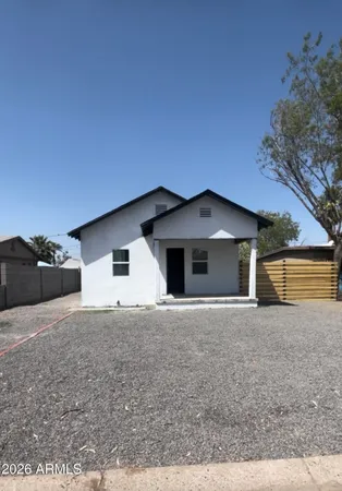 a house with trees in the background