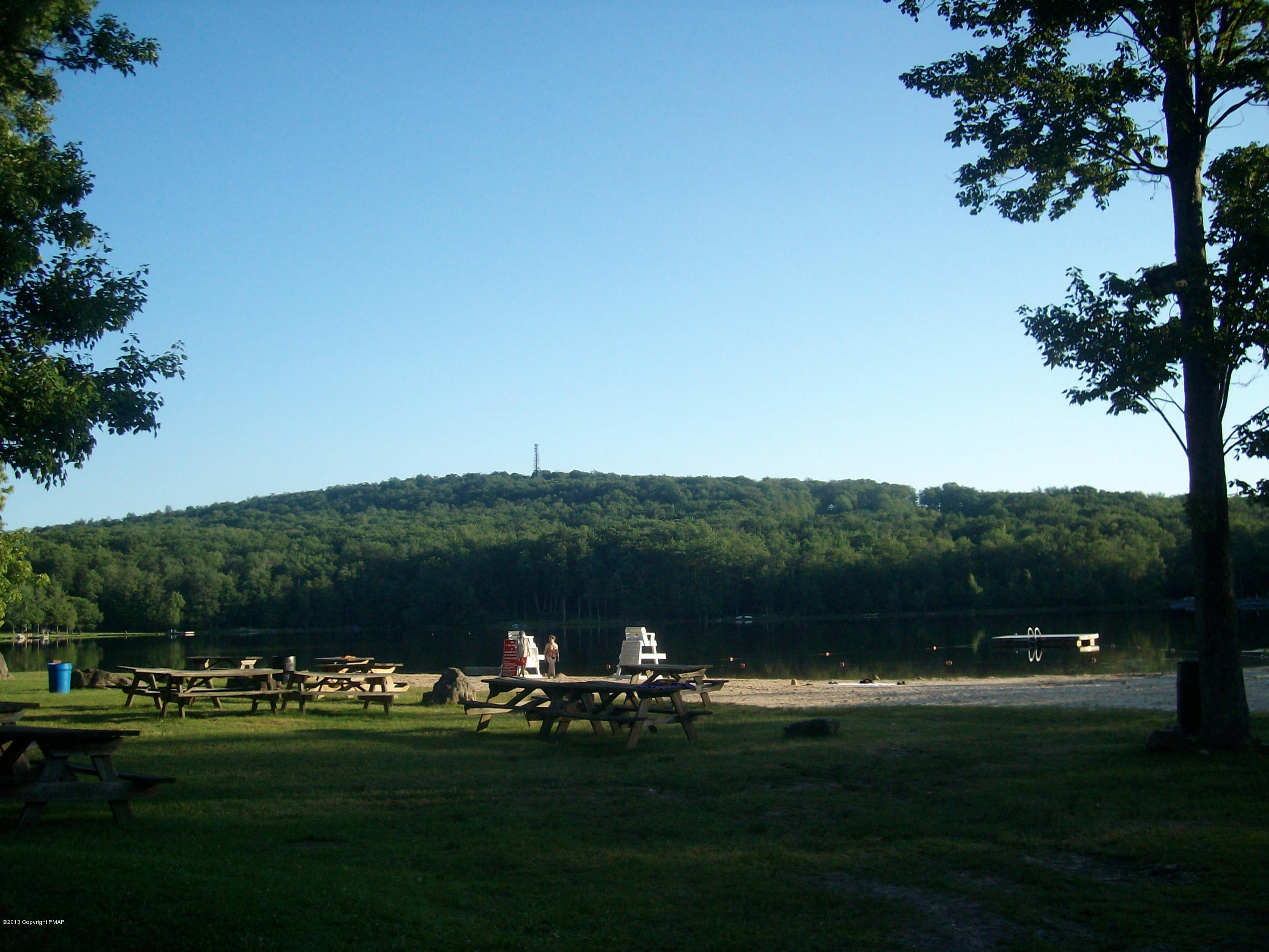 245 Selig Road Pocono Lake, PA 18347 - Photo 31 of 35 a view of a golf course with a lake
