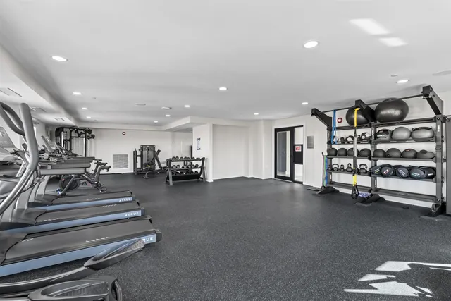 a view of a livingroom with gym equipment