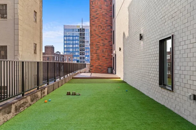 a view of a balcony with a garden