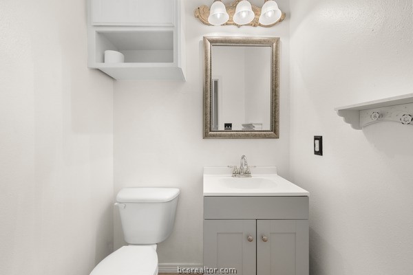 12 Raven's Nest Bryan, TX 77808 - Photo 16 of 46 a bathroom with a toilet a sink and mirror