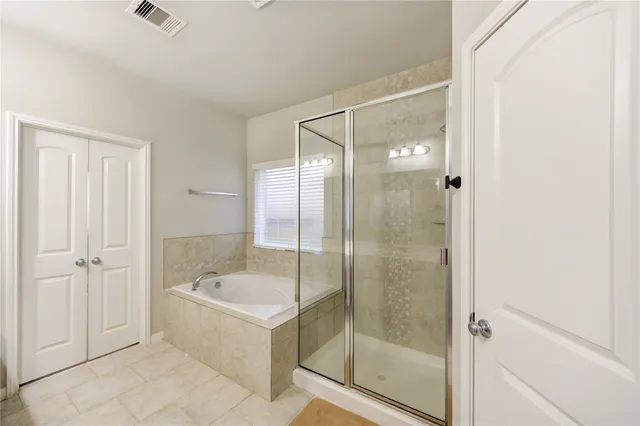 a bathroom with a double vanity sink mirror and