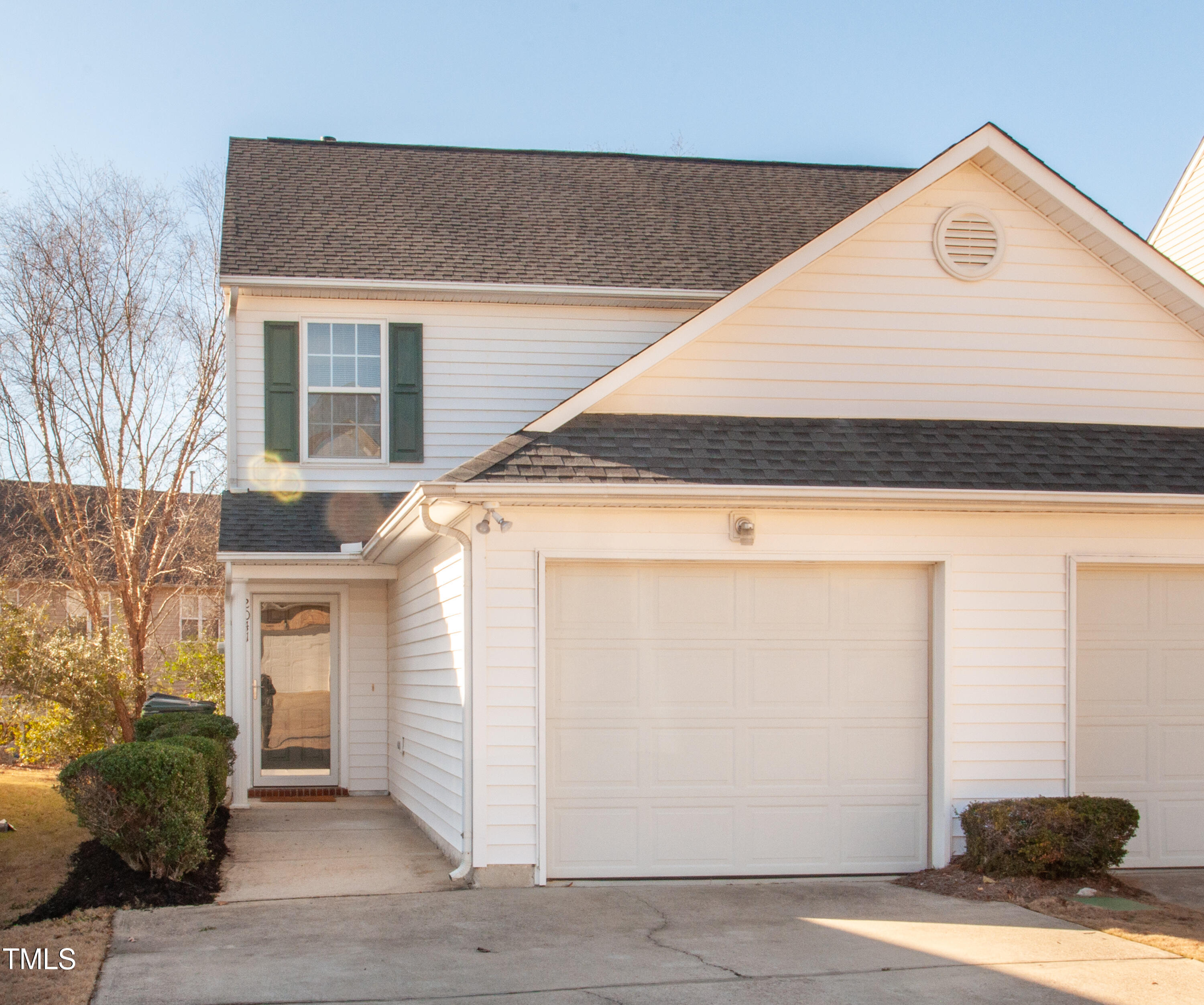 a view of a house with car parked