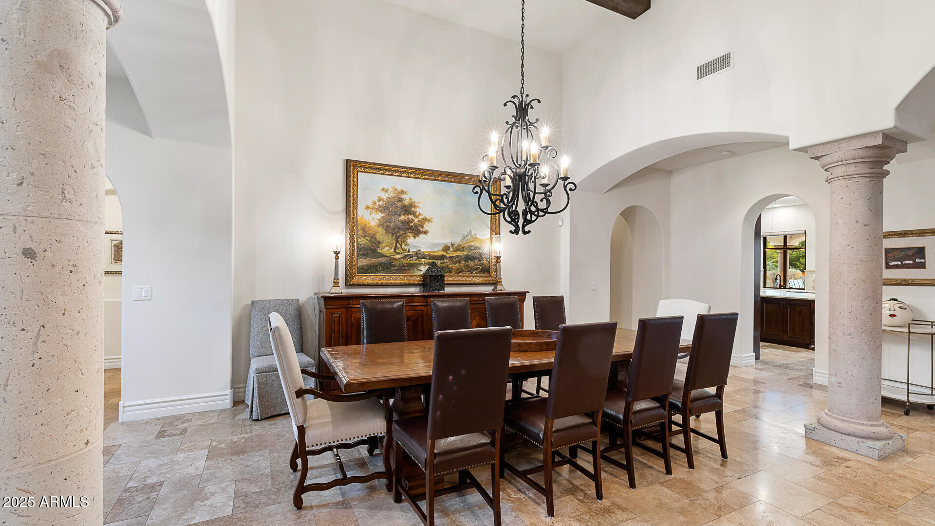 7120 North Quartz Mountain Road Paradise Valley, AZ 85253 - Photo 15 of 28 a view of a dining room with furniture and chandelier
