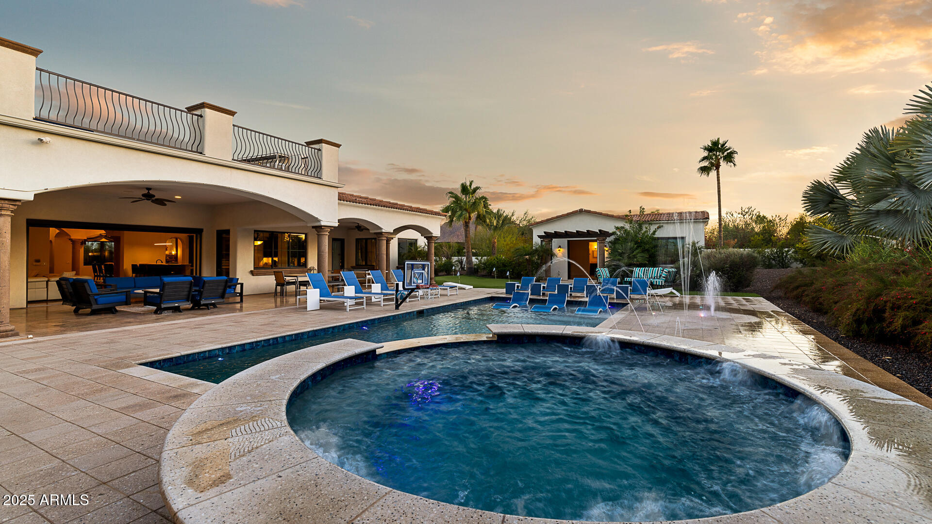 7120 North Quartz Mountain Road Paradise Valley, AZ 85253 - Photo 2 of 28 a view of a swimming pool with a patio